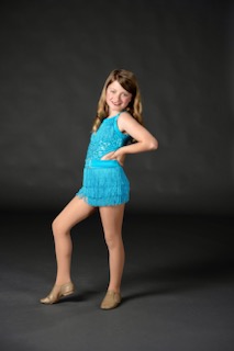 London posing for a picture while wearing a blue dress