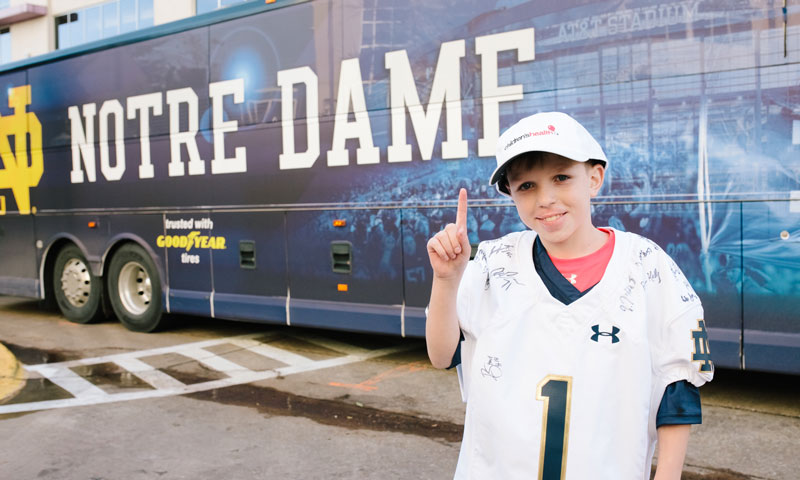 Henry in front of Notre Dame bus