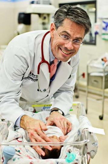 Doctor McKinney caring for an infant patient