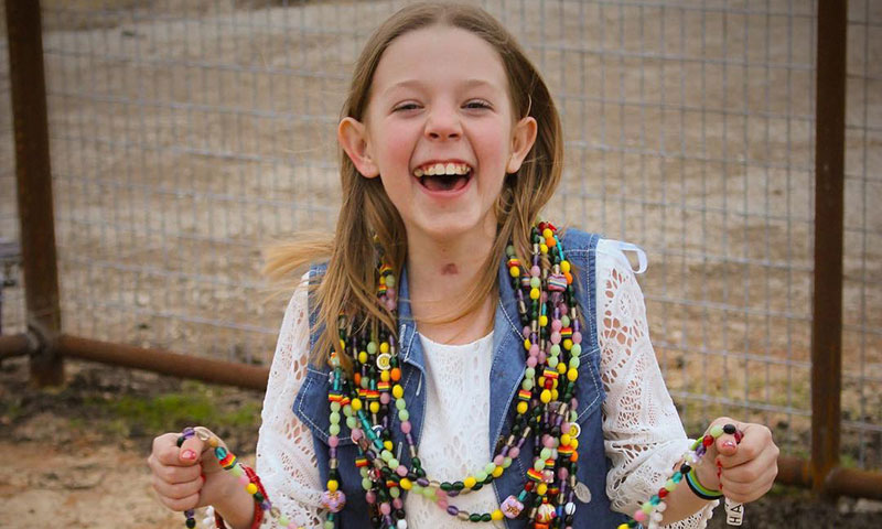 Hanna with beads round her neck