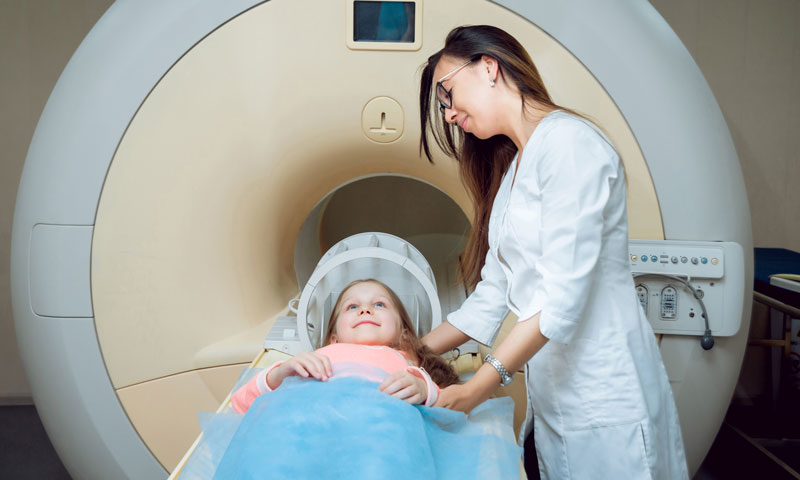 Doctor giving little girl an MRI