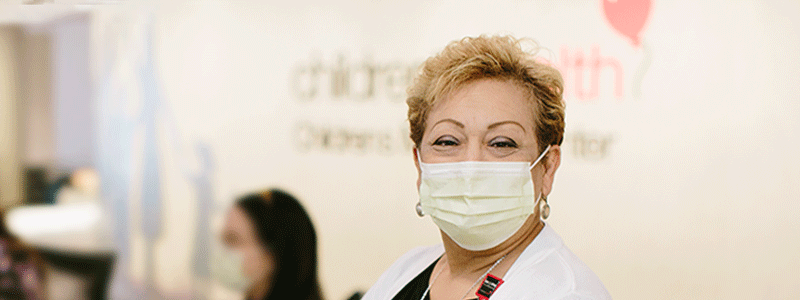 Suzzette Rivera at Children's Medical Center Dallas check-in desk.