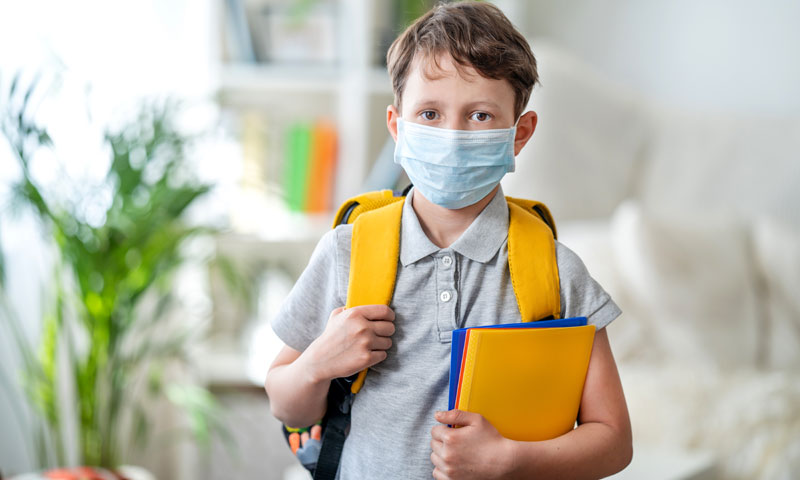 Boy going to school with mask on
