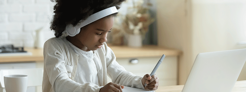 Young girl doing school work - Children's Health