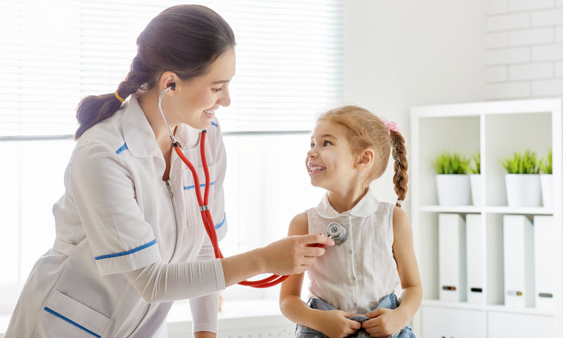 doctor examining a child girl in a hospital