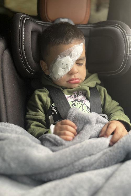 Little boy in car seat after visiting doctor