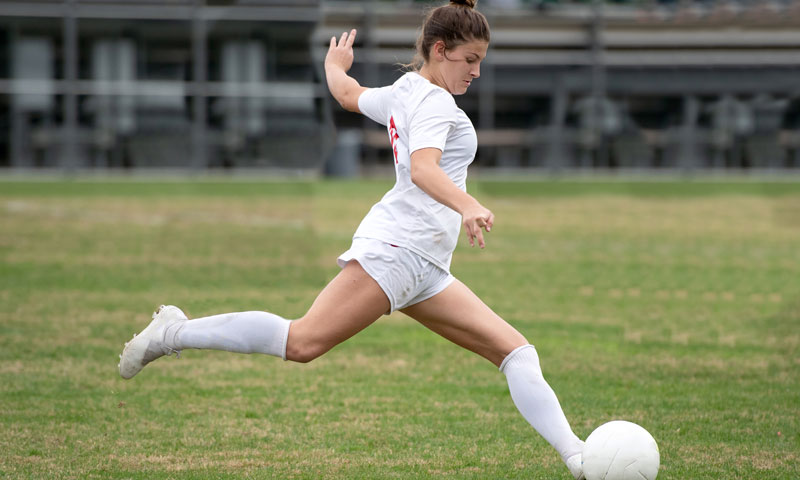 Female playing soccer