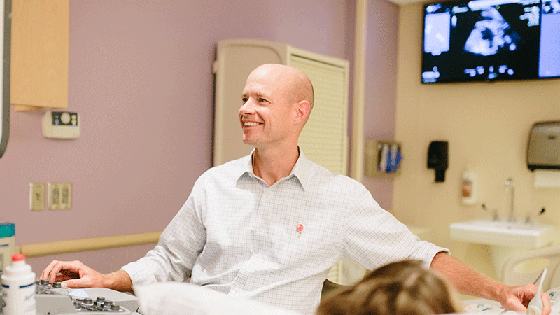 Dr. Colin Kane with patient at Children's Health