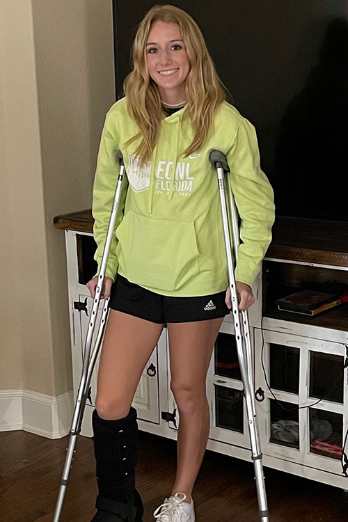 Girl on crutches smiling
