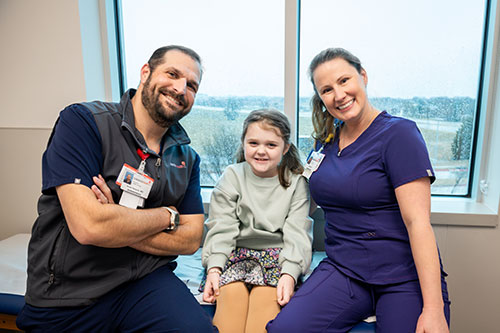 Dr. Israel Nosnik, Riley and Jennifer Ricker at the Children’s Health Urology Clinic.
