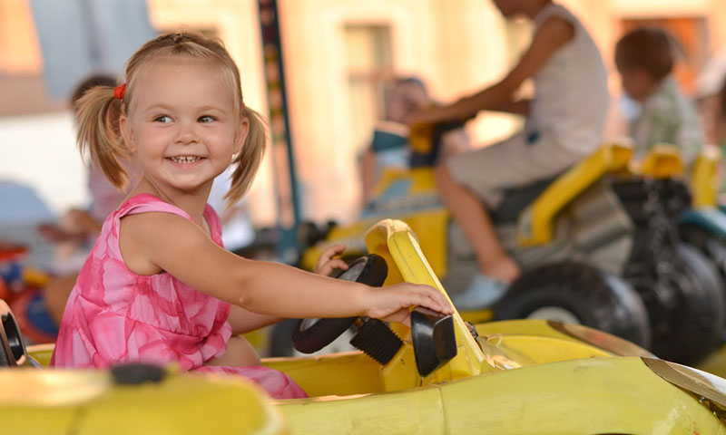 Little girl on ride at fair