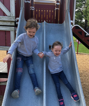Sanders and her sister at playground