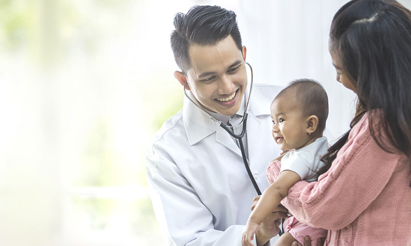 doctor checking baby with stethoscope 