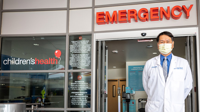 Dr. Vincent Want - MD, Chief Emergency Department in front of Children's Health Dallas Emergency entrance.