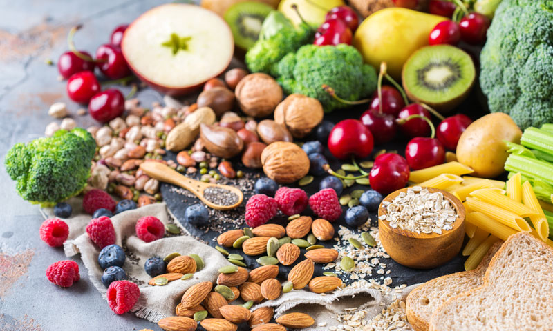 fruits, veggies, nuts, and grains on a table