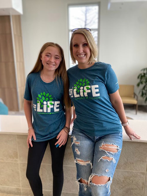 Charley and Rebecca wearing The Gift of Life t-shirts