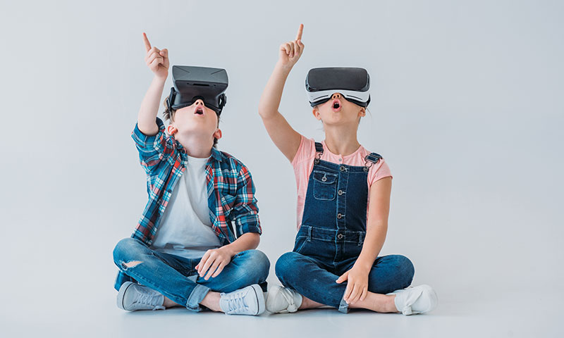 Two kids was using a VR system
